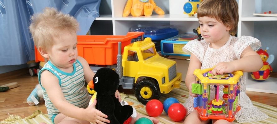 Children playing with toys in playroom